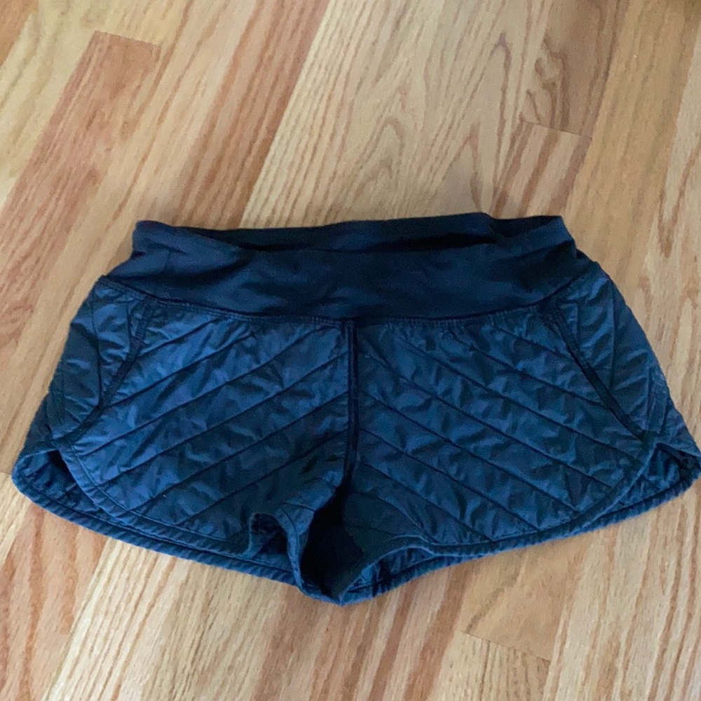 Black quilted shorts.